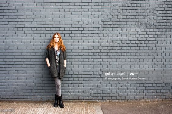 Leaning against a wall